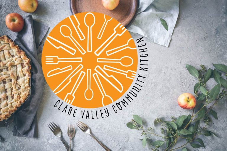 Clare Valley Community Kitchen logo on a table setting
